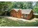 Aerial view of a single-Gathering home with a well-maintained lawn and a private backyard at 104 Southfork Dr, Woodstock, GA 30189