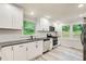 Bright, newly renovated kitchen featuring stainless appliances and subway tile backsplash at 104 Southfork Dr, Woodstock, GA 30189