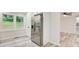 Eat-in kitchen featuring a stainless steel refrigerator and a nearby window at 104 Southfork Dr, Woodstock, GA 30189