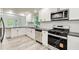 Modern kitchen featuring stainless steel appliances and new countertops at 104 Southfork Dr, Woodstock, GA 30189