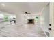 Spacious living room featuring hardwood floors and a stone fireplace at 104 Southfork Dr, Woodstock, GA 30189