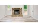 Bright living room showcasing a stone fireplace, neutral colors, and a door to the outside at 104 Southfork Dr, Woodstock, GA 30189