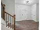 Inviting entryway with hardwood floors, a staircase, and a stylish front door that brings in light at 3131 Stonegate Sw Dr, Atlanta, GA 30331