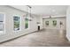 Bright living room with sleek floors, large windows, modern lighting, and a fireplace with a mantle at 3131 Stonegate Sw Dr, Atlanta, GA 30331