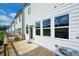 Cozy outdoor back porch featuring a light-colored siding and sliding glass doors at 428 Whitetail Cir, Canton, GA 30115