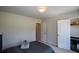 Bright bedroom with carpet and closet near a comfy-looking bed at 428 Whitetail Cir, Canton, GA 30115