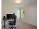 Spacious carpeted bedroom featuring a desk and natural light at 428 Whitetail Cir, Canton, GA 30115