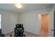 Spacious carpeted bedroom featuring a desk and door to closet at 428 Whitetail Cir, Canton, GA 30115