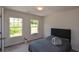 Bright bedroom with carpet, windows, and a comfy-looking bed at 428 Whitetail Cir, Canton, GA 30115