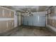 Image of a two-car garage with a new garage door ready for a new owner's custom finishes at 428 Whitetail Cir, Canton, GA 30115
