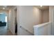 Well-lit hallway with neutral colors, connecting different areas of the home for easy navigation at 428 Whitetail Cir, Canton, GA 30115