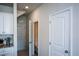 Hallway with access to a half bathroom, the garage, and the kitchen at 428 Whitetail Cir, Canton, GA 30115