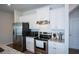 Modern kitchen showcasing stainless steel appliances, white cabinets, and light countertops at 428 Whitetail Cir, Canton, GA 30115