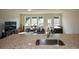 Open floor plan with granite countertop island, stainless steel sink, living room, and natural light at 428 Whitetail Cir, Canton, GA 30115
