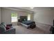 Large bedroom with ample natural light, a sitting area, and neutral tones for relaxation at 428 Whitetail Cir, Canton, GA 30115