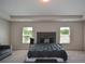 Large bedroom with ample natural light, a sitting area, and neutral tones for relaxation at 428 Whitetail Cir, Canton, GA 30115
