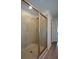 A tiled walk-in shower features sliding glass doors and modern fixtures at 428 Whitetail Cir, Canton, GA 30115