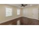 Bright bedroom featuring beautiful hardwood flooring, neutral paint, closet, and plenty of natural light at 1885 N Druid Hills Ne Rd, Atlanta, GA 30319