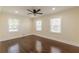 Spacious bedroom featuring hardwood flooring, a ceiling fan, recessed lighting, and ample natural light at 1885 N Druid Hills Ne Rd, Atlanta, GA 30319