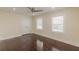 Bedroom with hardwood floors, neutral paint, and natural light from two windows at 1885 N Druid Hills Ne Rd, Atlanta, GA 30319