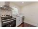 Well-lit kitchen features stainless steel appliances and white cabinetry at 1885 N Druid Hills Ne Rd, Atlanta, GA 30319