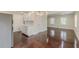 Open-concept living and dining area with hardwood floors, recessed lighting, and white cabinetry at 1885 N Druid Hills Ne Rd, Atlanta, GA 30319