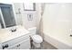 Bathroom with shower and toilet and a vanity and light-filled window at 2436 Loughridge Dr, Buford, GA 30519