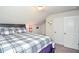 Comfortable bedroom featuring a bed with a cozy blanket and two closets at 2436 Loughridge Dr, Buford, GA 30519