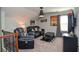 Cozy bonus room with reclining chairs, TV, carpeted floors, and movie-themed decor at 2436 Loughridge Dr, Buford, GA 30519