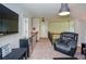 Spacious bonus room featuring seating, carpet, and a sleek refreshment center at 2436 Loughridge Dr, Buford, GA 30519