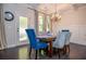 Charming dining room showcases coffered ceilings, stylish lighting, and elegant decor at 2436 Loughridge Dr, Buford, GA 30519
