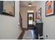 Inviting home entryway with hardwood floors, staircase, and a decorative mirror and console at 2436 Loughridge Dr, Buford, GA 30519