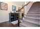 Welcoming entryway with hardwood floors, staircase, and decorative console table at 2436 Loughridge Dr, Buford, GA 30519