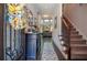 Inviting home entryway with beautiful hardwood floors, staircase, and view to the living area at 2436 Loughridge Dr, Buford, GA 30519