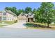 Well-maintained brick home featuring a manicured lawn and driveway, and lovely landscaping at 2436 Loughridge Dr, Buford, GA 30519