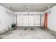 Spacious garage with an automatic door, concrete flooring, and ample room for parking and storage at 2436 Loughridge Dr, Buford, GA 30519