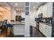 Modern kitchen with white cabinetry, granite countertops, and stainless steel appliances at 2436 Loughridge Dr, Buford, GA 30519