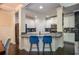 Modern kitchen with white cabinets, a breakfast bar, and stainless steel appliances at 2436 Loughridge Dr, Buford, GA 30519