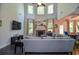 Bright living room featuring high ceilings, a stone fireplace, and large windows at 2436 Loughridge Dr, Buford, GA 30519