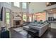 Open living room with stone fireplace, large windows, and views to the dining area at 2436 Loughridge Dr, Buford, GA 30519