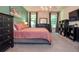 A spacious primary bedroom offers beautiful views and comfortable furnishings at 2436 Loughridge Dr, Buford, GA 30519
