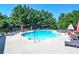 Inviting community pool with lounge chairs and umbrellas perfect for relaxation and enjoying sunny days at 2436 Loughridge Dr, Buford, GA 30519