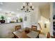 Bright dining area with view of kitchen, stairs and living room with ceiling fan at 655 Mead Se St # 3, Atlanta, GA 30312