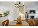 Open dining room and living space with wooden floors, ample natural light, fireplace and staircase at 655 Mead Se St # 3, Atlanta, GA 30312