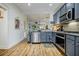 Charming kitchen featuring stainless steel appliances, gray cabinets, and view into the dining room at 655 Mead Se St # 3, Atlanta, GA 30312