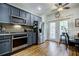Spacious kitchen featuring stainless steel appliances, gray cabinets and adjacent dining area at 655 Mead Se St # 3, Atlanta, GA 30312