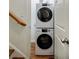 Laundry area with stacked washer and dryer units near the stairs at 655 Mead Se St # 3, Atlanta, GA 30312