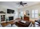 Living room showcasing a fireplace, hardwood floors, and plantation shutters at 655 Mead Se St # 3, Atlanta, GA 30312