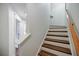 Staircase with wooden steps and white risers, complemented by a wooden handrail at 655 Mead Se St # 3, Atlanta, GA 30312