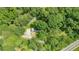 Overhead shot showcasing the property's layout, including the driveway, yard, and proximity to trees at 6600 N Beulah Rd, Lithia Springs, GA 30122